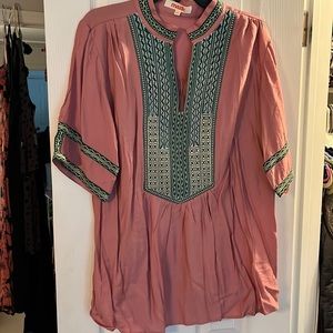 Woman’s pink top with embroider design